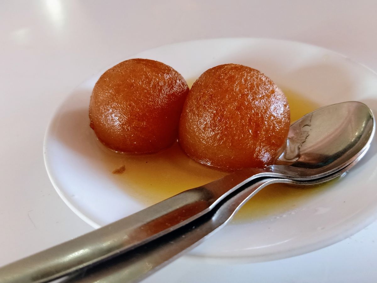 Gulab jamun dessert dumplings in sweet syrup