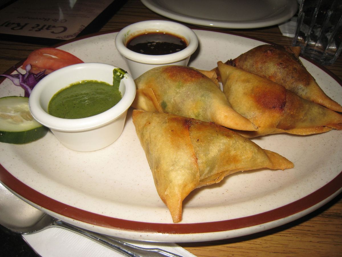 Crispy vegetable samosas served with mint and tamarind chutney